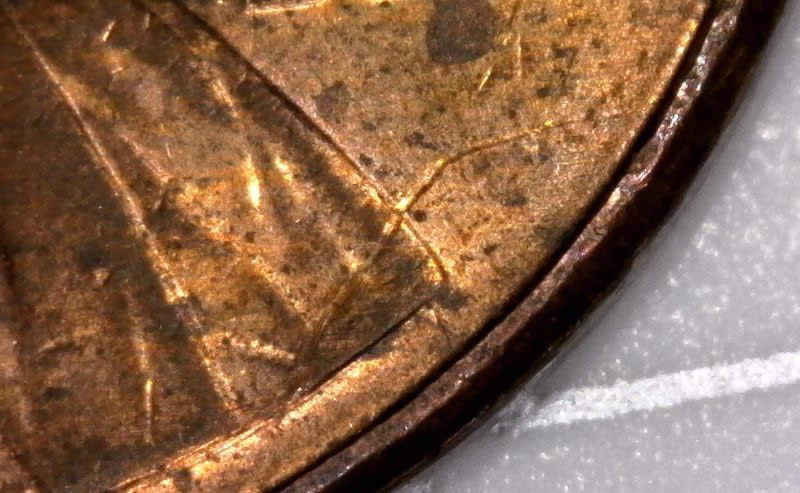 2007-P-Lincoln-Cent-Struck-Through-Wire-Brush-Bristle-Maybe-Or-Thread?